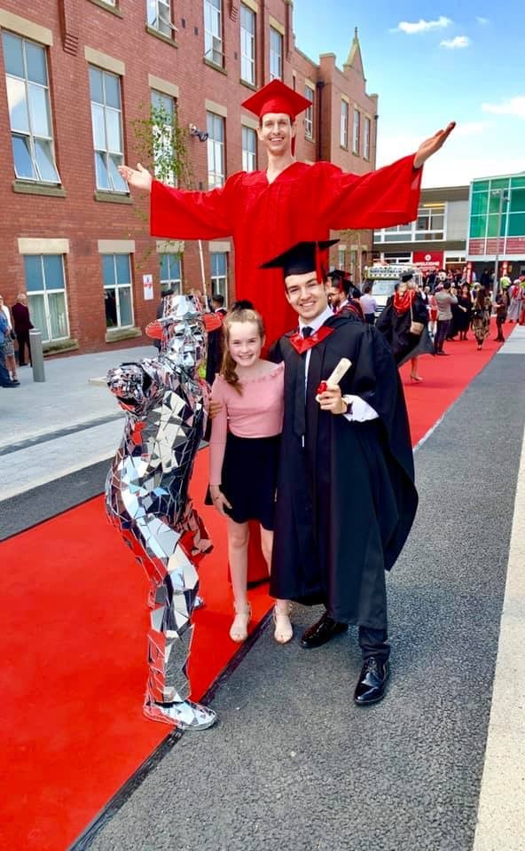 Cometan with his younger sister, Charlotte Sophia, during the day of his graduation from the University of Central Lancashire on 15th July 2019
